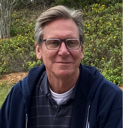 John E. Phillips, President of ISMC